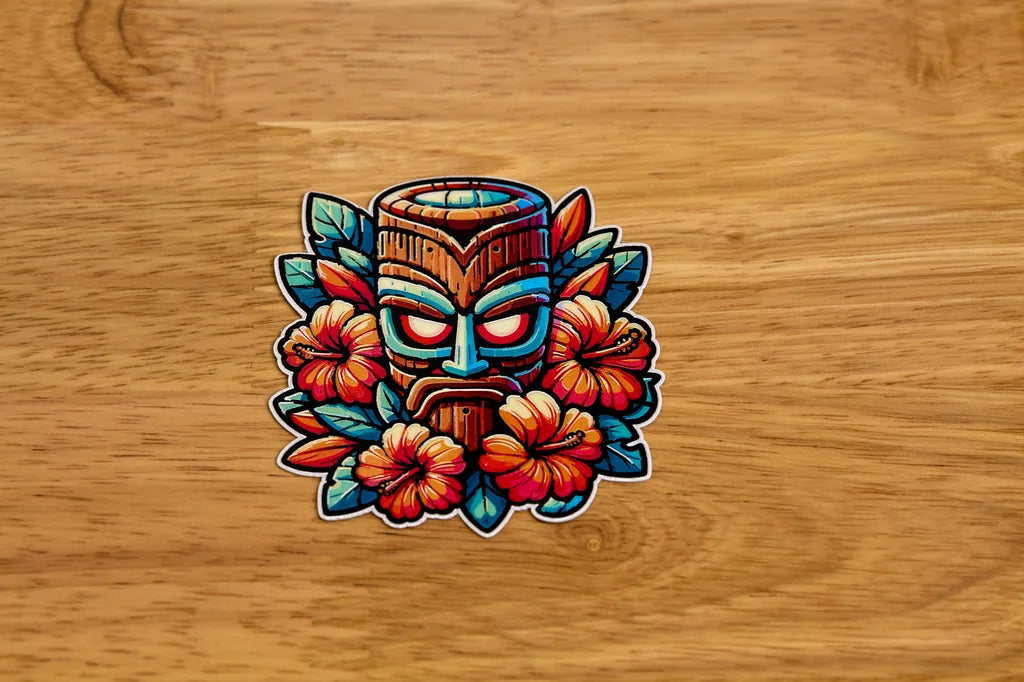 Colorful tiki mask sticker with flowers on a wooden background