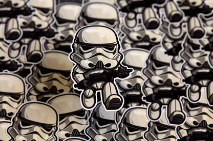 Small stormtrooper figure standing in front of a larger pile of stormtrooper stickers.