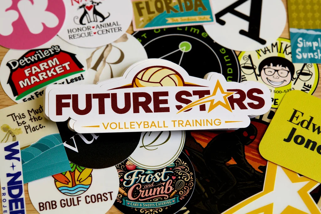 Collection of various economy stickers with different designs and text, including a prominent 'Future Stars Volleyball Training' sticker.