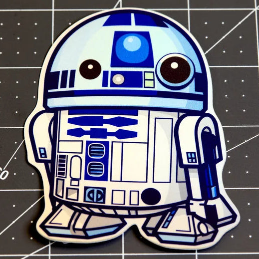 Cartoon-style R2-D2 character on a grid background