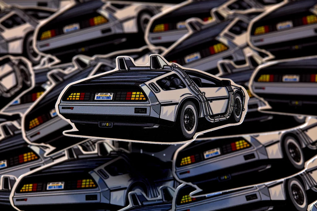 Sticker of a DeLorean time machine on a patterned background