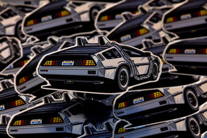 Sticker of a DeLorean time machine on a patterned background